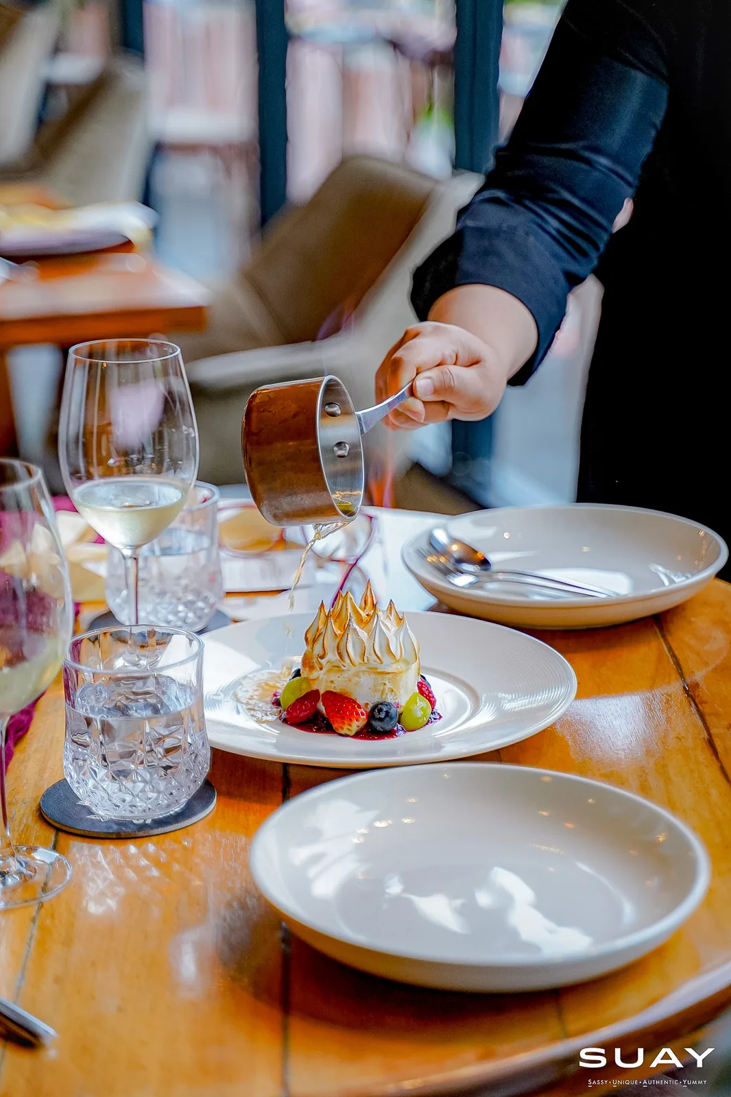 A flambé dessert being served